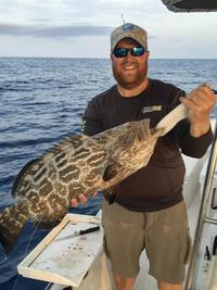 Captain Joshua with Black Grouper.